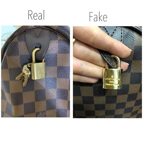 how to spot a fake louis vuitton lock and key|louis vuitton coin pouch keychain.